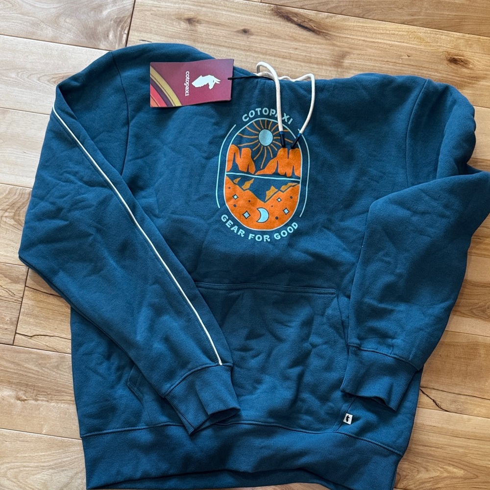 Cotopaxi Teal Hoodie with Vibrant Orange Design